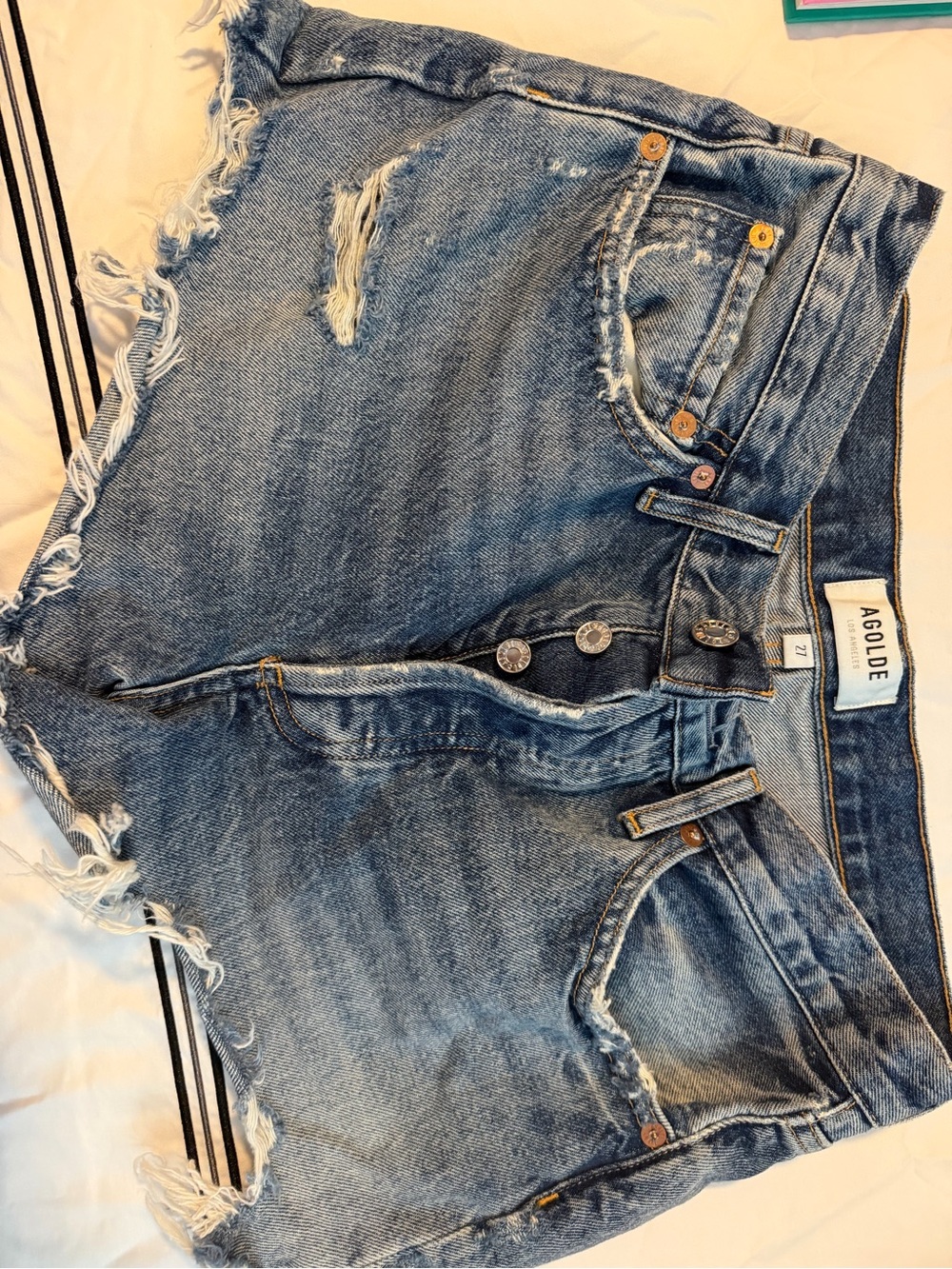 AGOLDE Distressed Light Blue Denim Shorts with Frayed Hem